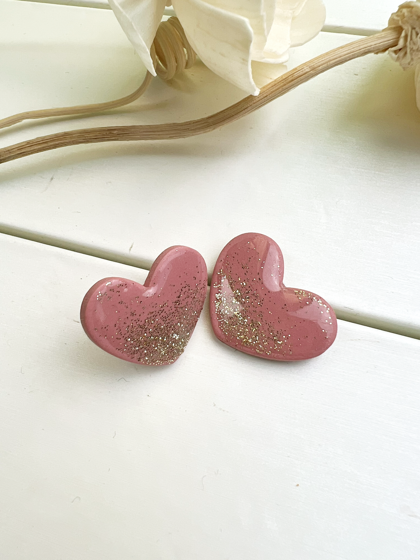 Blush pink heart earrings with gold glitter