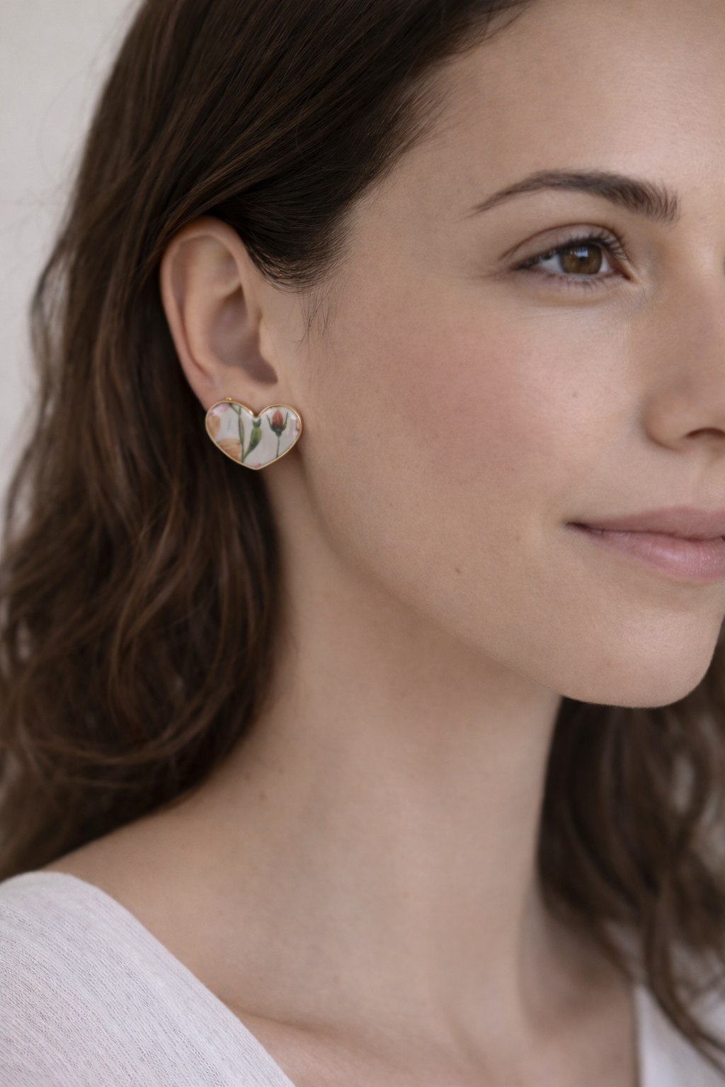 Floral heart earrings with gold edge.