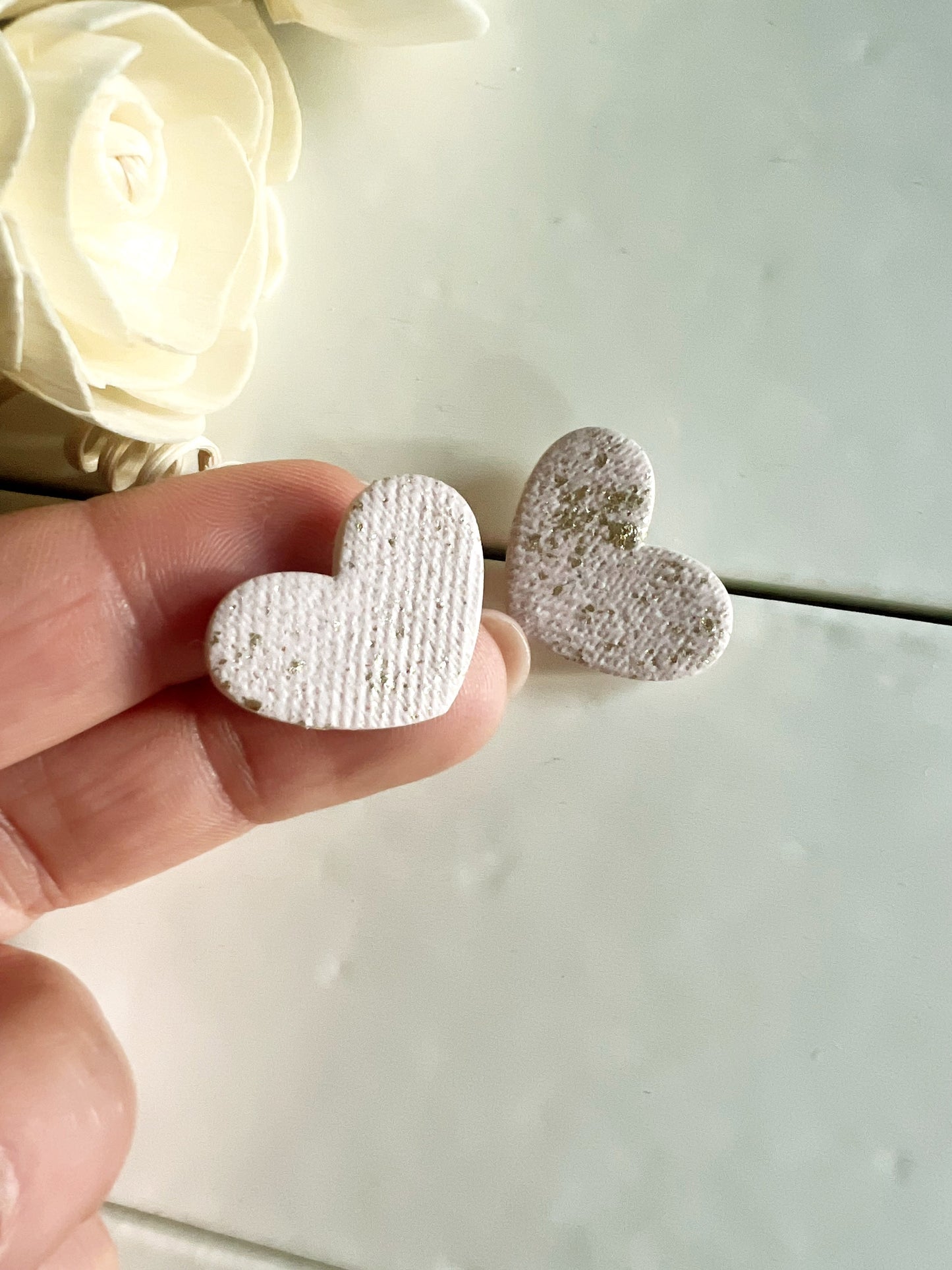 White heart earrings with gold leaf and fabric texture