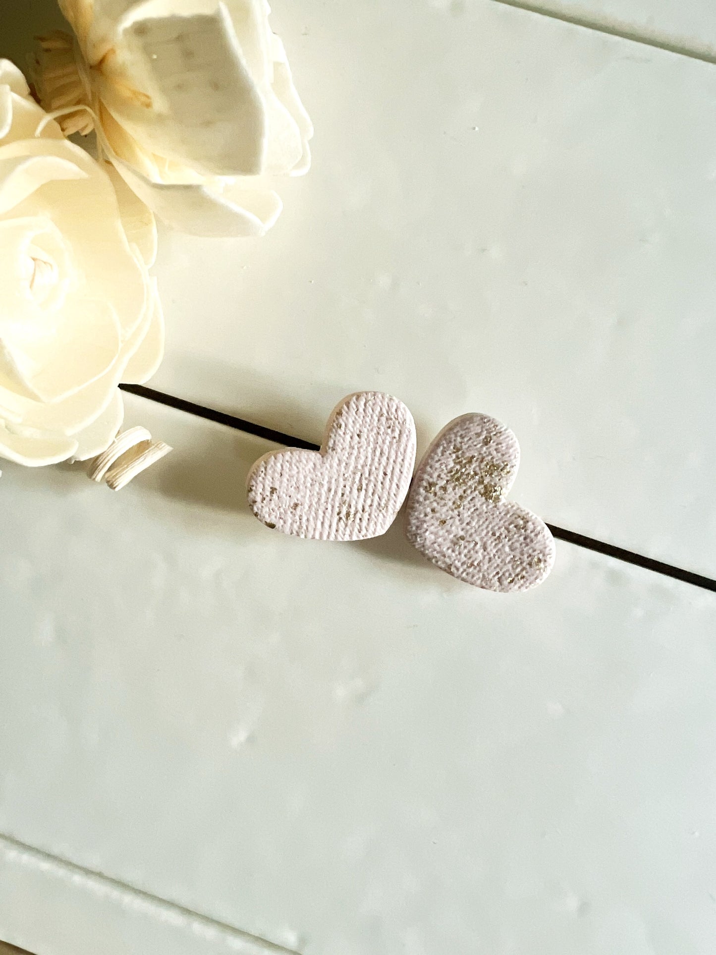 White heart earrings with gold leaf and fabric texture