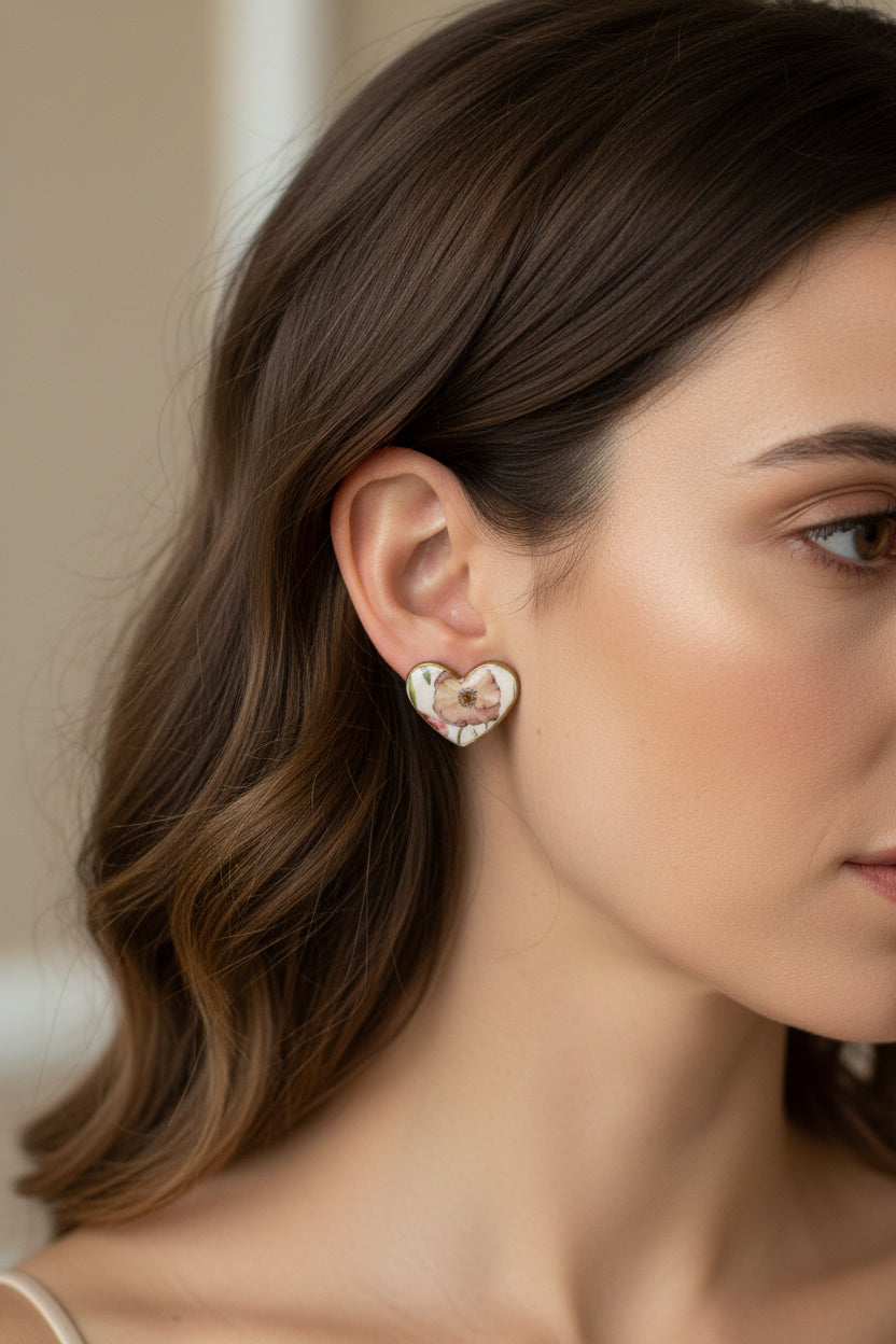 Floral heart earrings with gold edge.