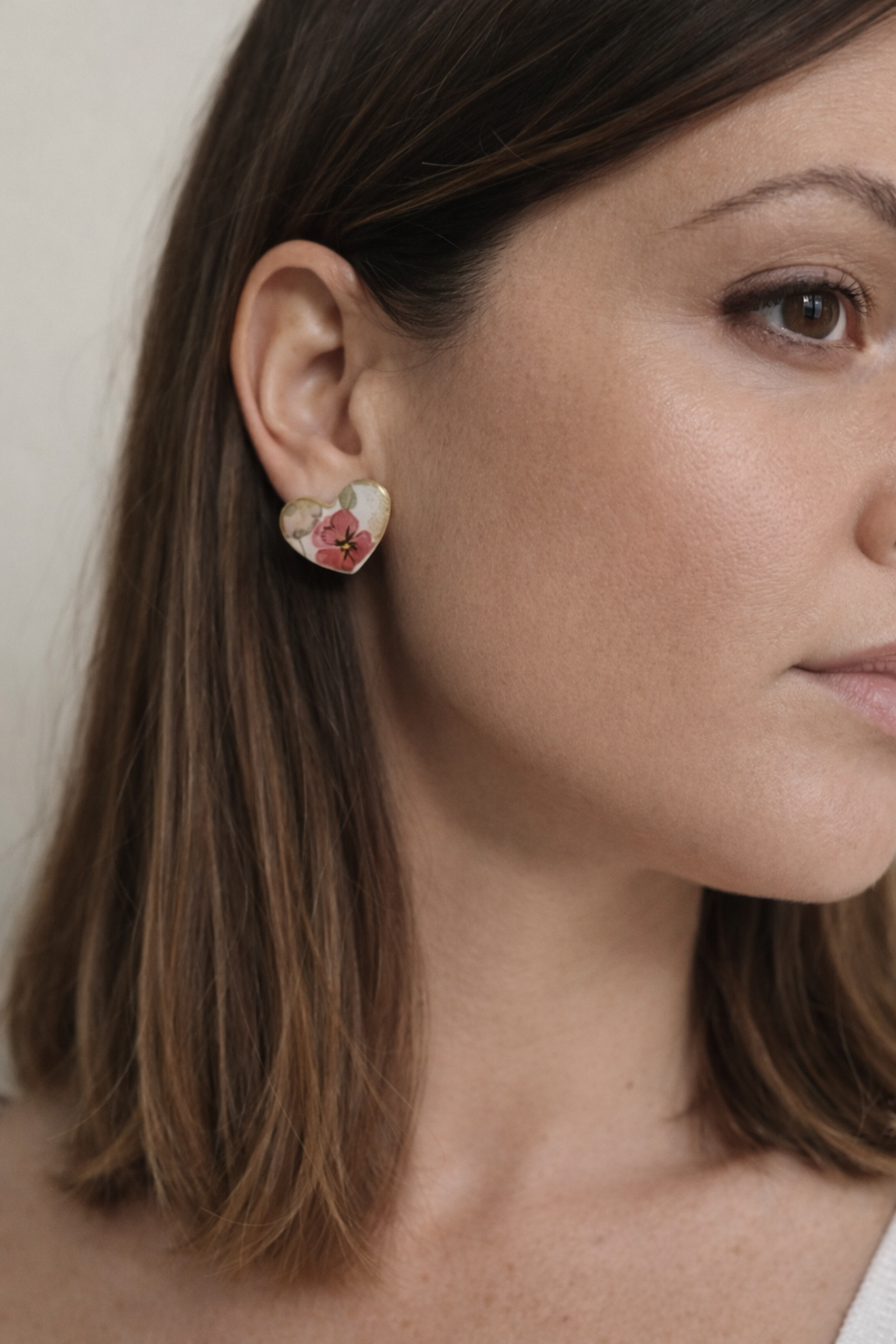 Floral heart earrings with gold edge.