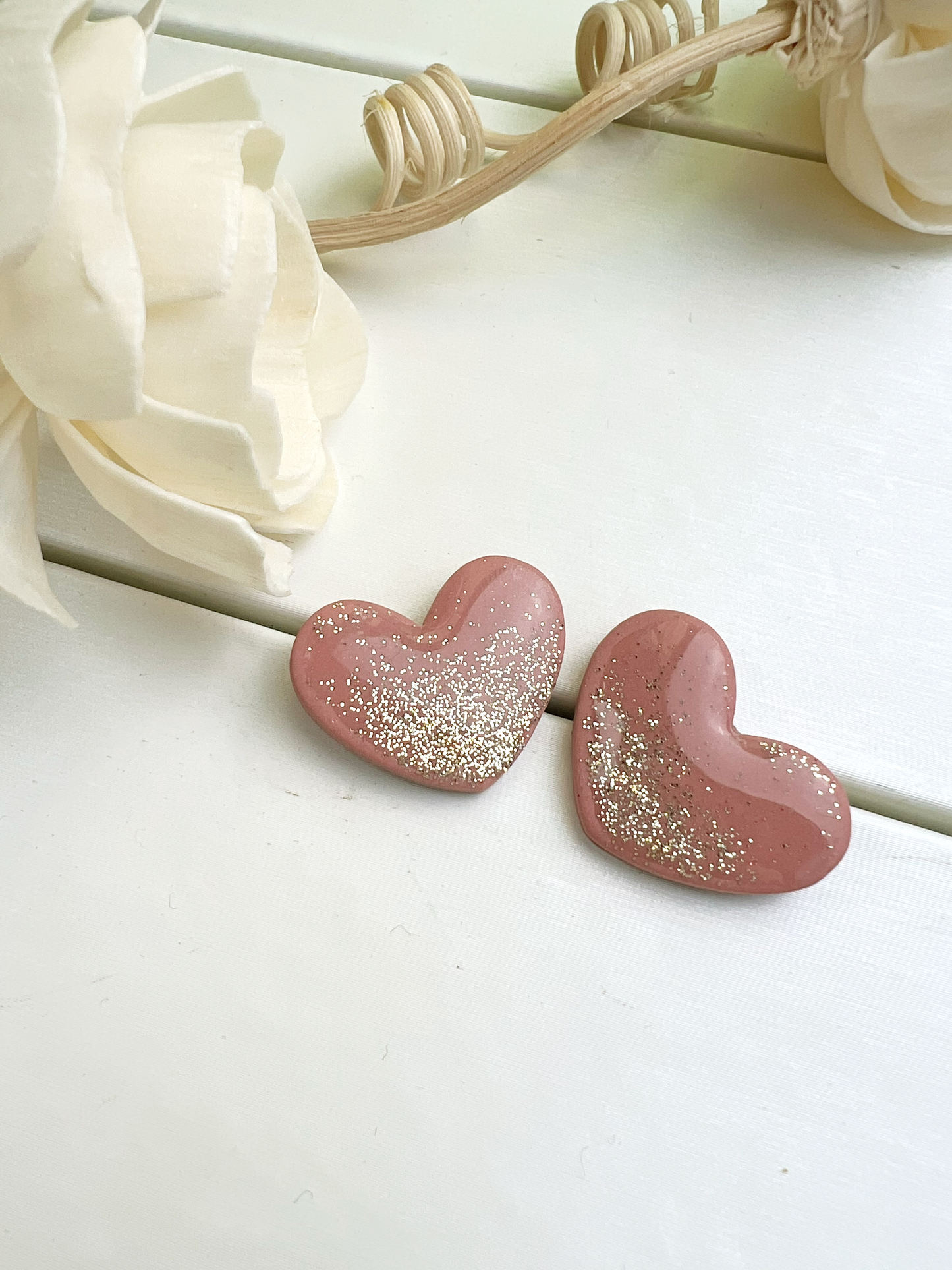 Blush pink heart earrings with gold glitter