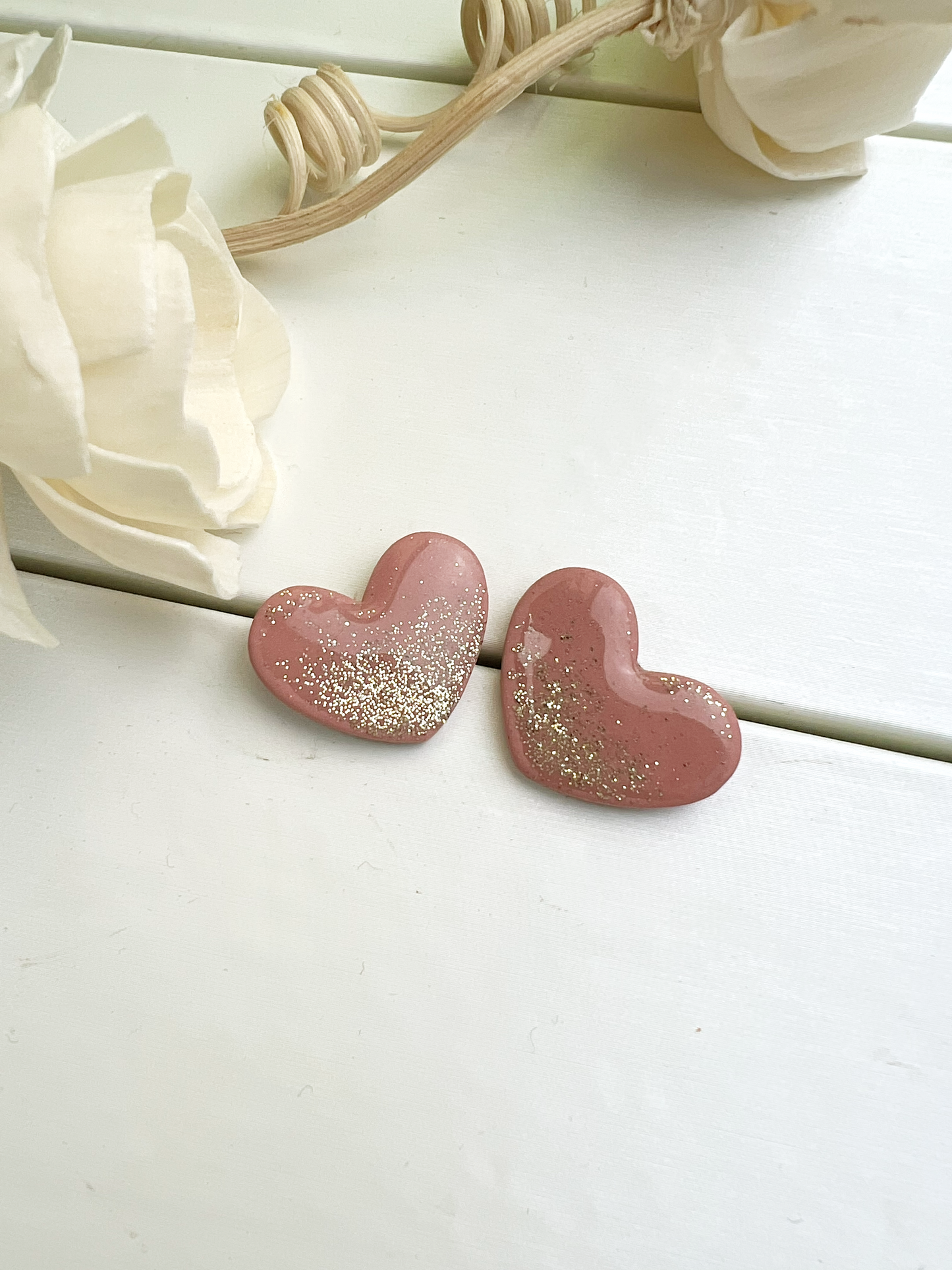 Blush pink heart earrings with gold glitter